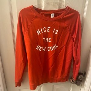 This is an Old Navy Orangeish-Red Long sleeve shirt. It is an XS